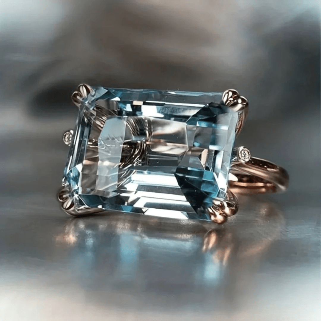 Emerald - Cut Sky Blue Topaz Solitaire Ring in Rose Gold - Ring