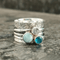 Handcrafted Floral Silver Spinner Ring with Blue Gemstones - Ring