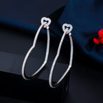 Heart Top Elongated Hoop Earrings with Crystal Pavé - Joyería